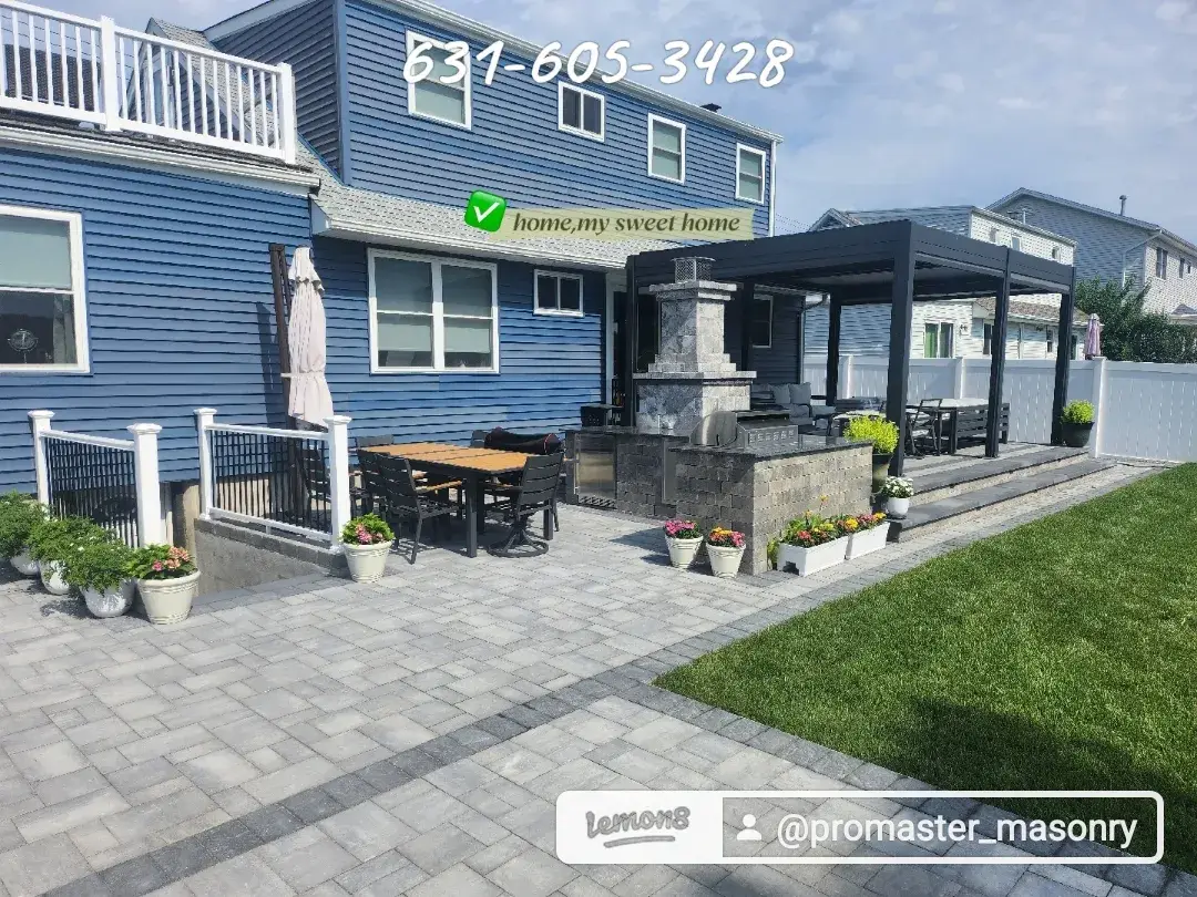 Paver patio with outdoor kitchen and pergola by Promaster Maintenance Corp, Long Island, NY