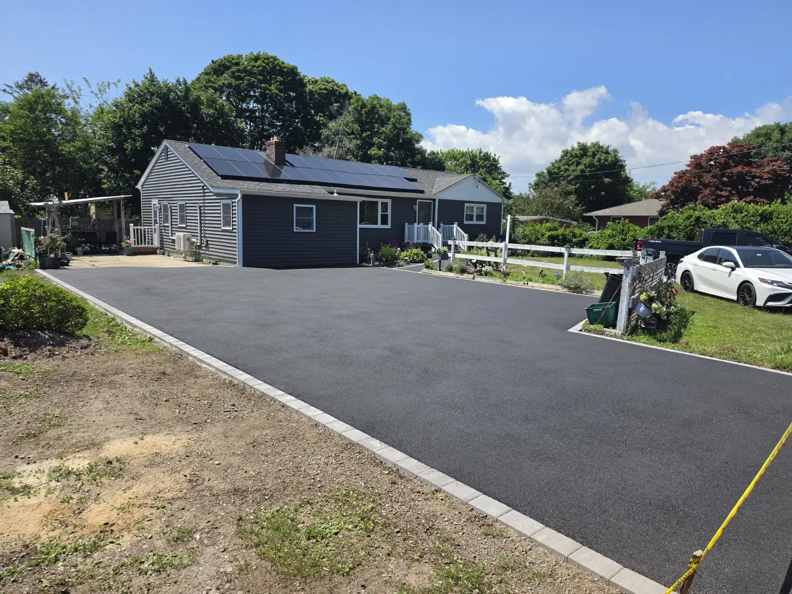 Asphalt driveway with paver edging by Promaster Maintenance Corp, Long Island, NY
