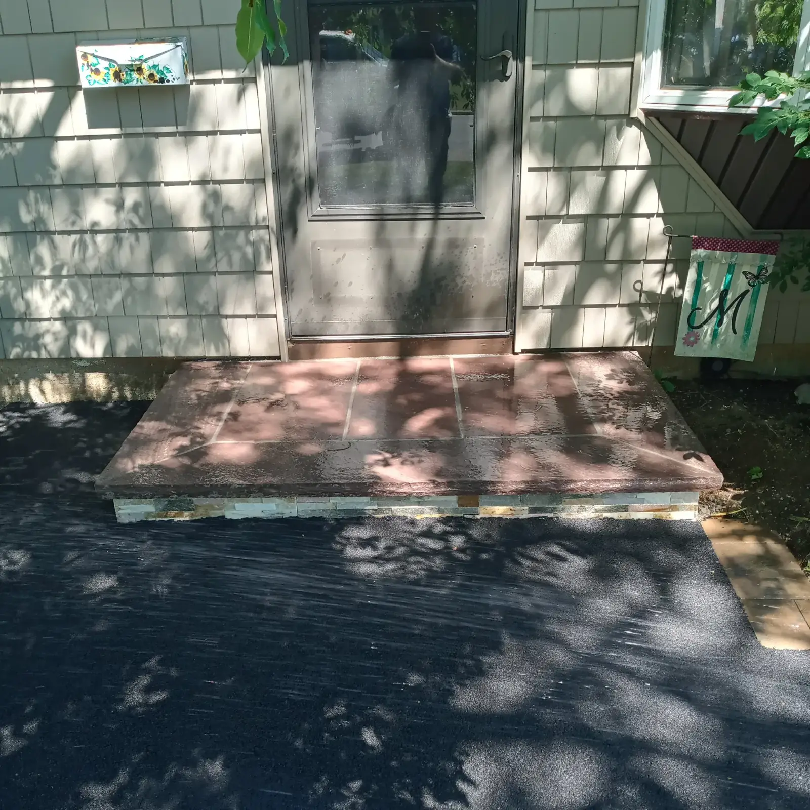 Flagstone stoop with stacked-stone riser by Promaster Maintenance Corp, Long Island, NY