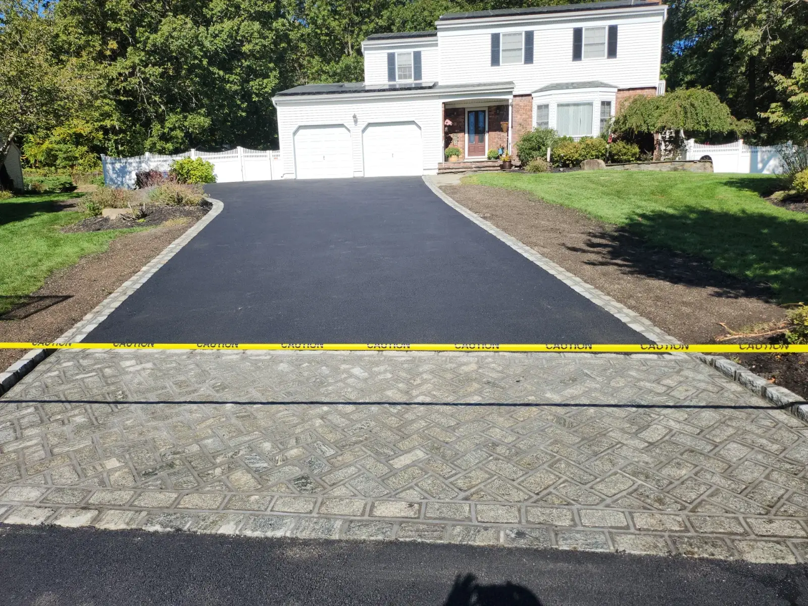 Asphalt driveway with granite herringbone apron by Promaster Maintenance Corp, Long Island, NY