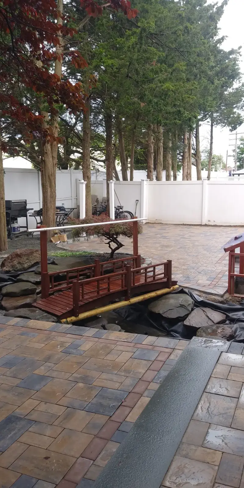 Paver patio seat wall by Promaster Maintenance Corp, Long Island, NY