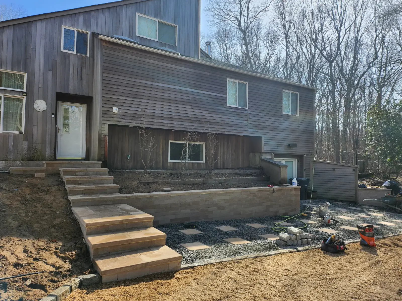 Retaining wall, steps and stepping stones by Promaster Maintenance Corp, Long Island, NY