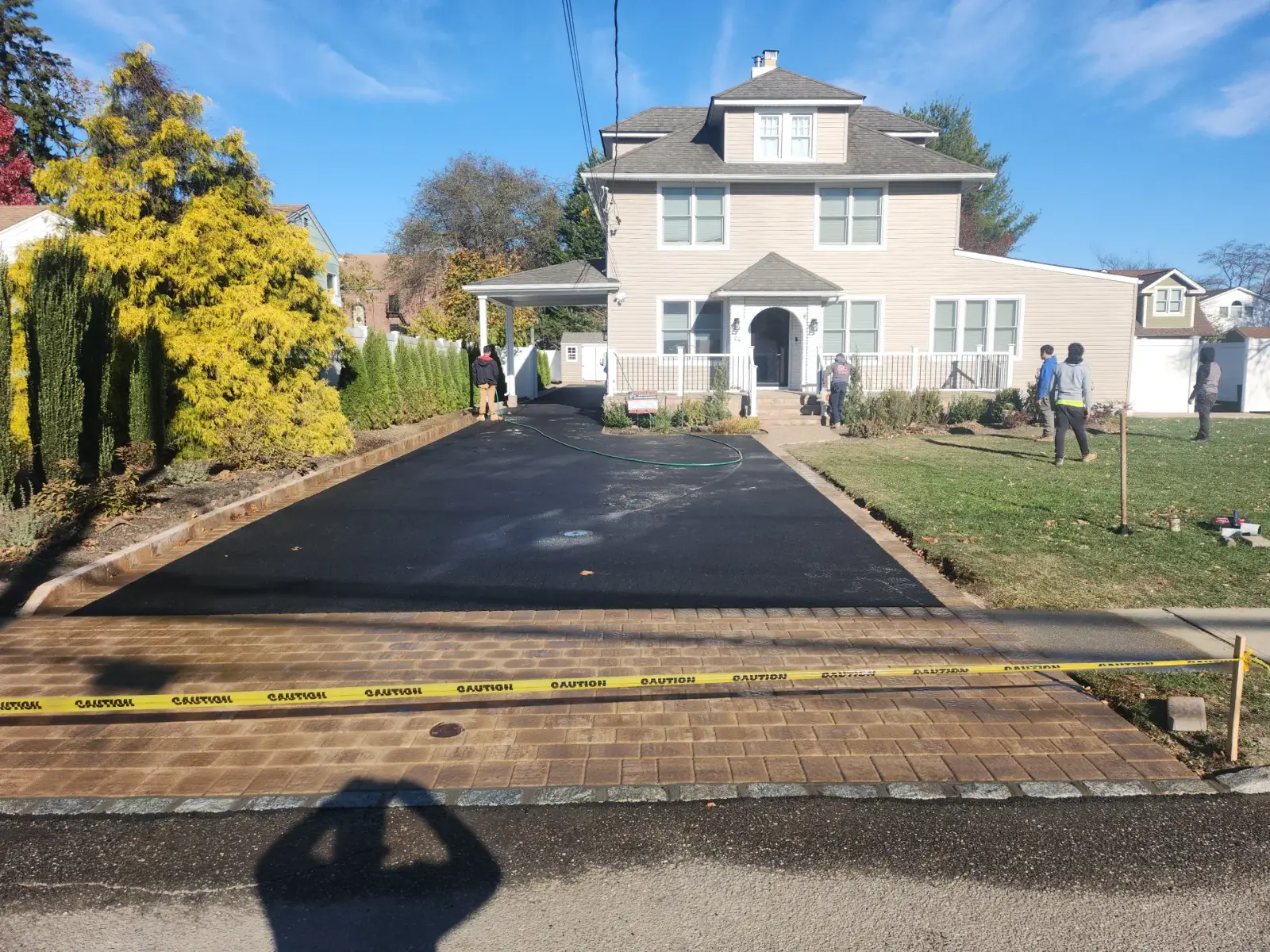 Asphalt driveway with paver apron by Promaster Maintenance Corp, Long Island, NY