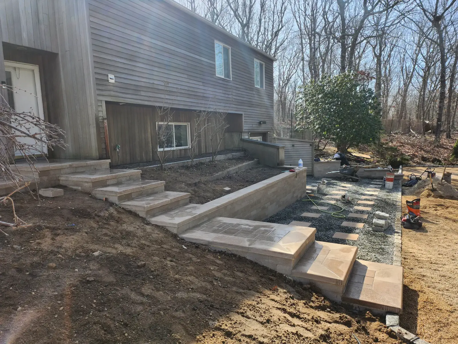 Retaining wall and stone steps by Promaster Maintenance Corp, Long Island, NY