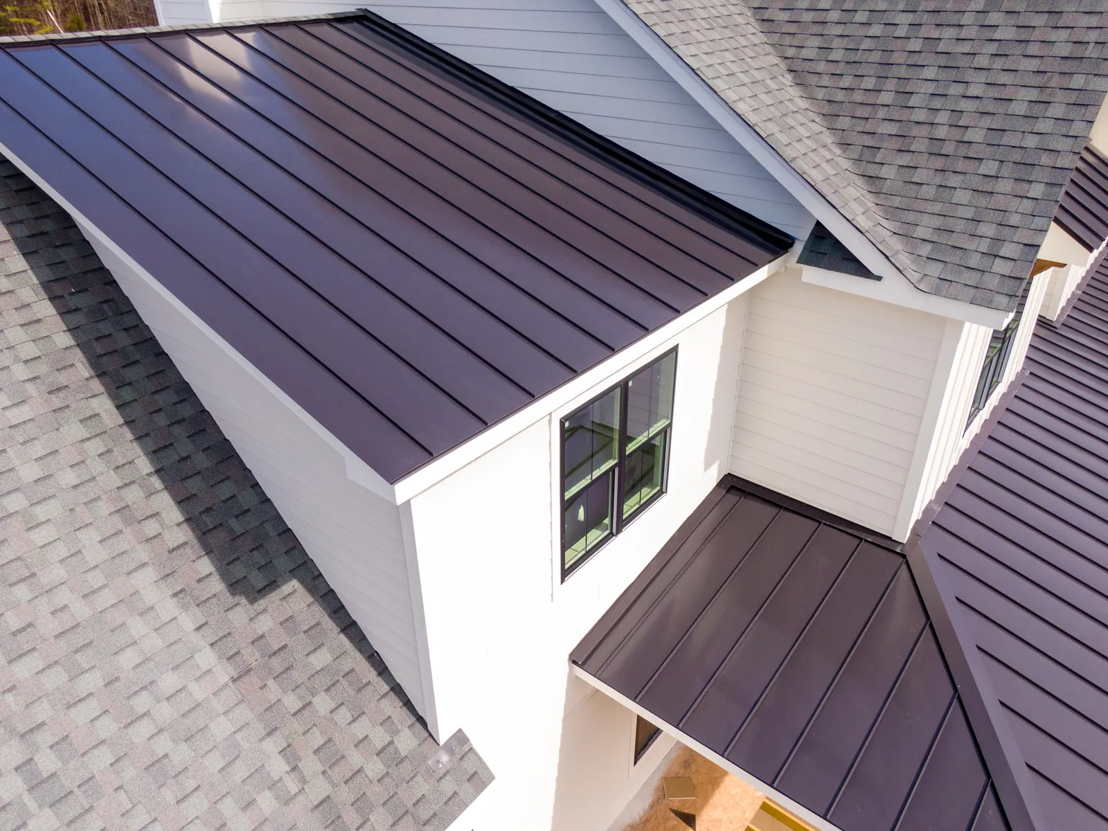 Metal roof over a dormer by Promaster Maintenance Corp, Long Island, NY