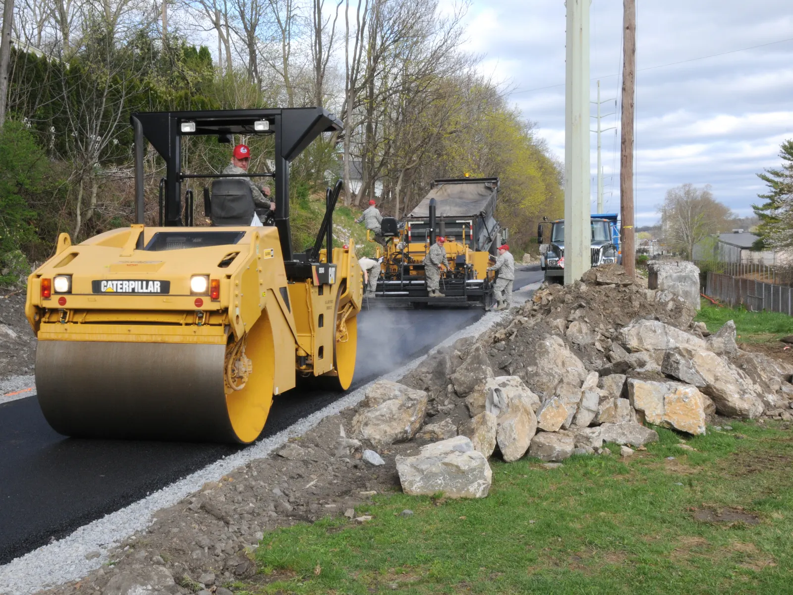 Roller compacting a fresh asphalt mat