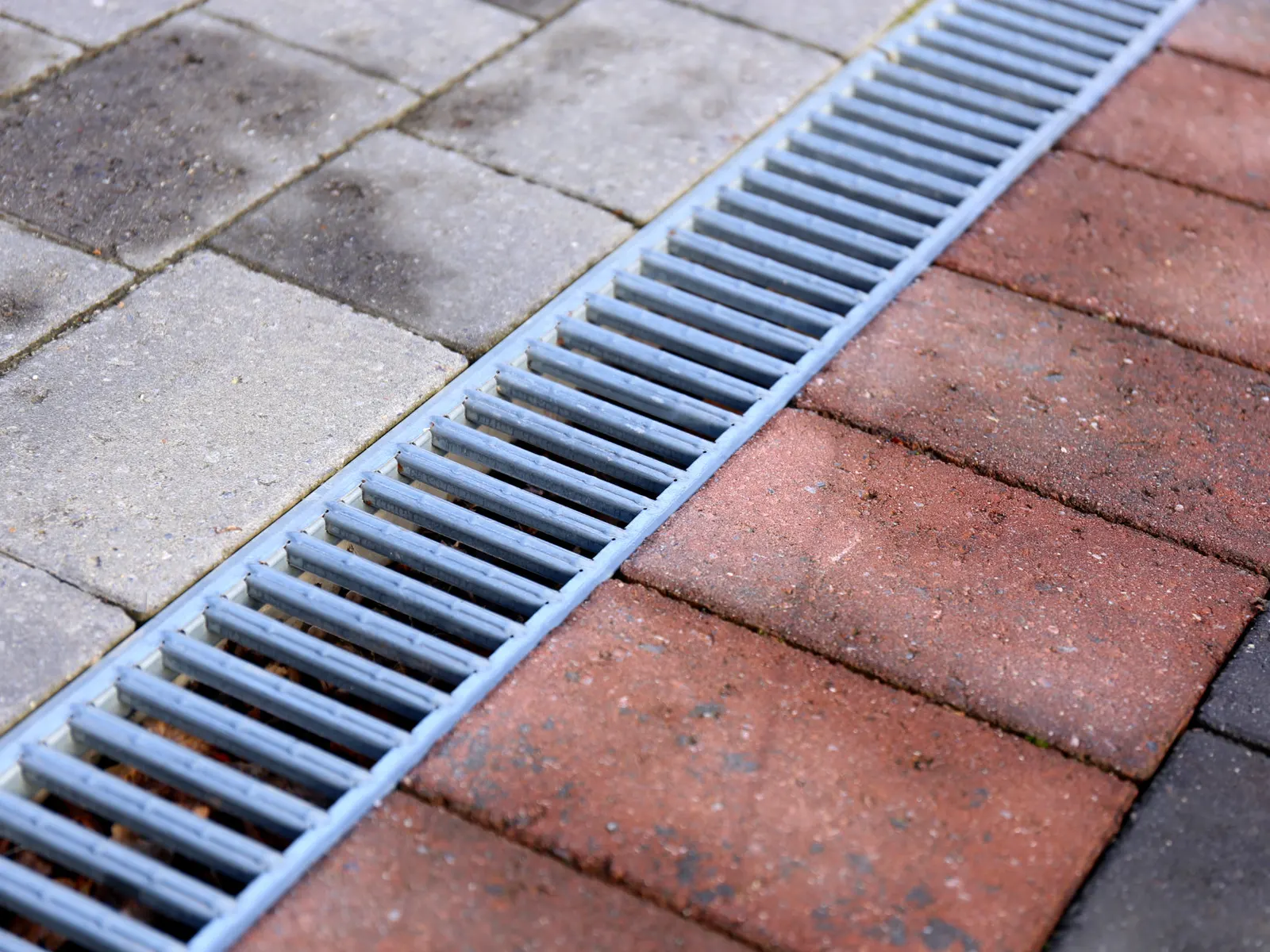 Channel drain set into a paved surface